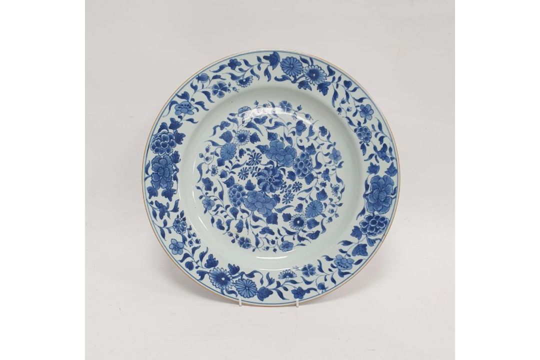18th/19th century Chinese porcelain charger with underglaze blue decoration of scrolling foliage, - Image 1 of 2