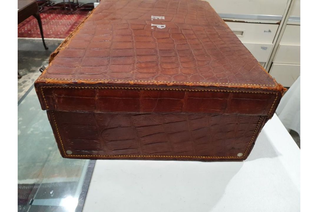 A crocodile skin suitcase, early to mid 20th century, gilt lettering stamped for John Bagshaw & - Image 11 of 36