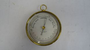 Pillischer barometer in brass case with temperature gauge, marked 'M Pillischer, London', 12cm