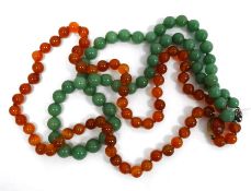 Green hardstone bead necklace, graduated with silver clasp (Length 62cm approx.) and a cornelian