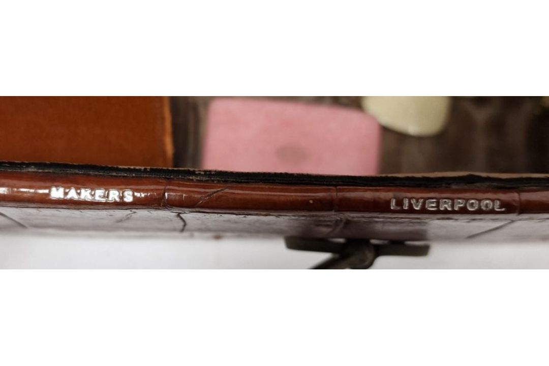 A crocodile skin suitcase, early to mid 20th century, gilt lettering stamped for John Bagshaw & - Image 4 of 36
