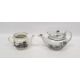 Early 19th century English porcelain teapot and cover printed en grisaille with travellers in - Image 1 of 2