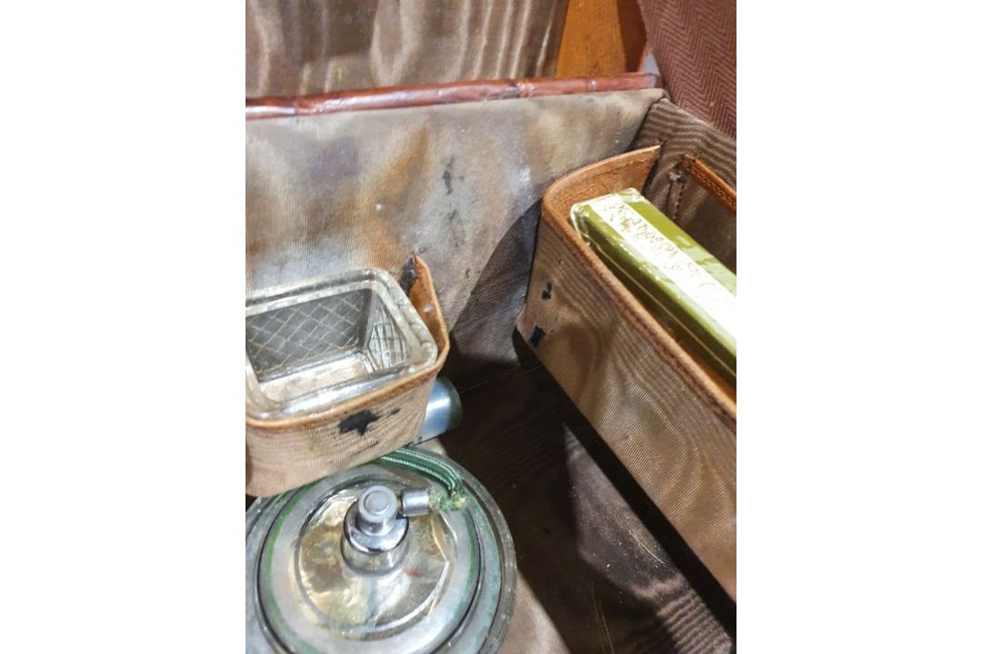 A crocodile skin suitcase, early to mid 20th century, gilt lettering stamped for John Bagshaw & - Image 28 of 36