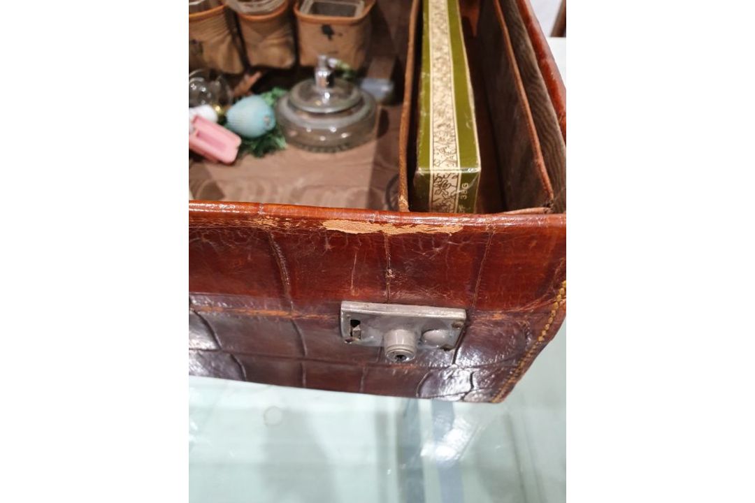 A crocodile skin suitcase, early to mid 20th century, gilt lettering stamped for John Bagshaw & - Image 32 of 36