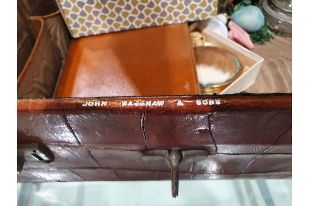A crocodile skin suitcase, early to mid 20th century, gilt lettering stamped for John Bagshaw & - Image 30 of 36