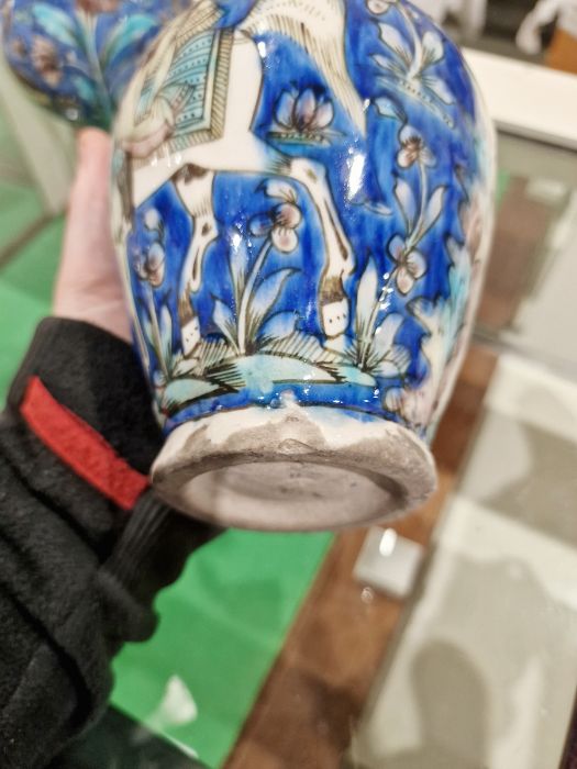 Two 19th century Persian Kajar Dynasty pottery vases, the first bottle-shaped painted with birds - Image 23 of 26