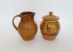 Suzy Cree (b.1952) a terracotta lidded jar with yellow slip glaze and finger swipe decoration,