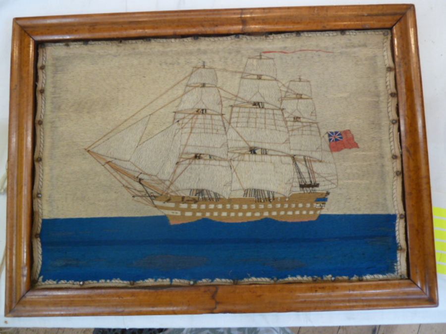 19th century mariner's woolwork picture showing a three-masted schooner in full sail, ensign