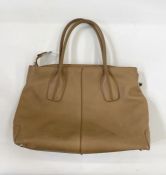 A Tod's caramel coloured leather bag, zip fastening, with side buckle marked 'Tod's', double