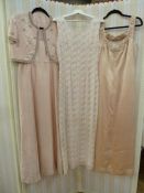 Full-length beaded evening dress labelled 'Ma Cherie, Haute Couture Model' in pale pink chiffon,