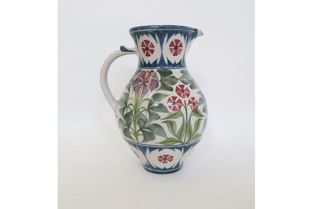 Laurence McGowan (b.1942) a stoneware pitcher with floral decoration on white ground, signed to base - Image 1 of 4