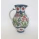 Laurence McGowan (b.1942) a stoneware pitcher with floral decoration on white ground, signed to base - Image 1 of 4