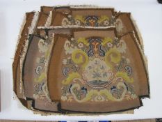 Six antique needlepoint tapestry chair covers with scrolling foliate patterns surrounding a fig tree