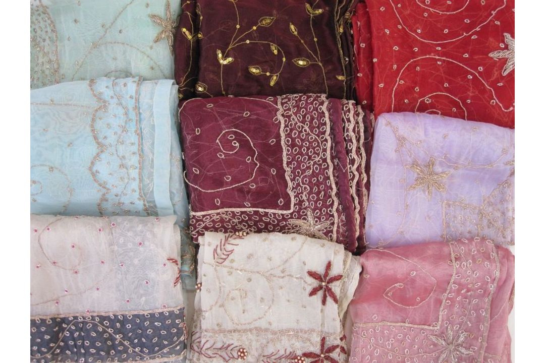 Box of middle-eastern sequinned and bejewelled textiles, two small silk cushions, three small fabric - Image 1 of 3