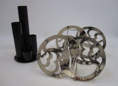 Norwegian black metal tea light holder, the centrepiece of four graduated columns on tray, by
