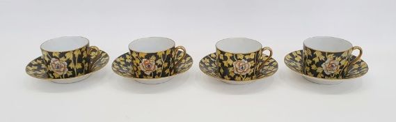 Set of four Limoges gilt and floral decorated cups and saucers, factory mark to base (4)