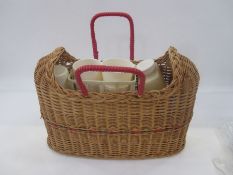Vintage wicker and plastic picnic set with red cane handles