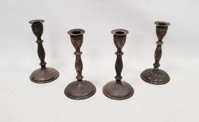 Set of four Victorian weighted candlesticks on turned stems, on circular bases, Sheffield 1894,
