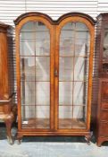 20th century walnut display cabinet in the Dutch taste, with two astragal glazed doors, on squat