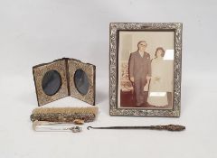 Silver-mounted travelling photograph frame, floral repousse decorated, London, date marks won,