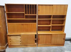 Two mid-century teak lounge units with sliding doors, open shelf recesses and drinks cabinet, on
