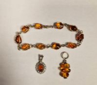 Collection of silver amber jewellery to include bracelet and two pendants