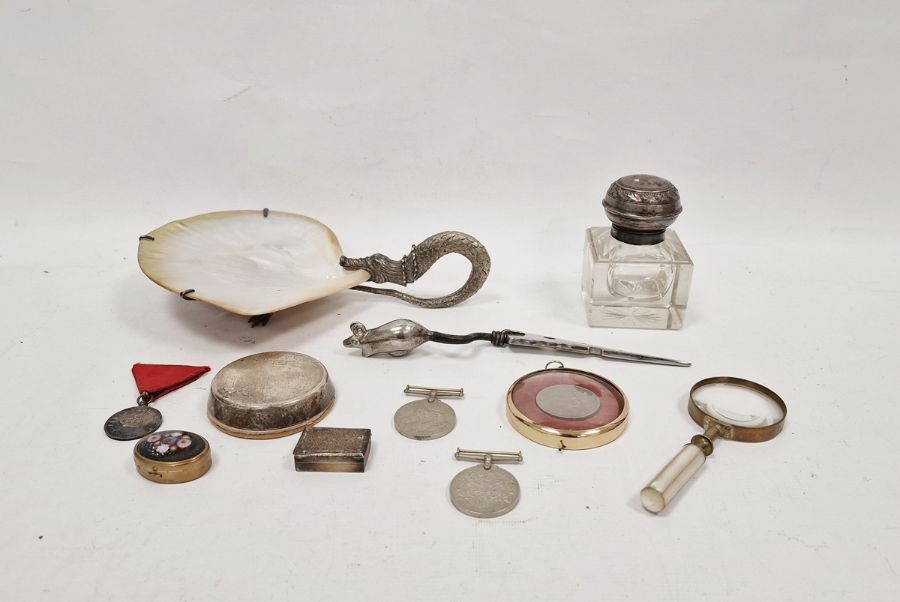 Handled tray with shell bowl and white metal handle, raised on three feet, a 1939-45 War medal