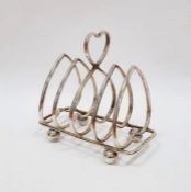 George V silver toast rack, heart-pattern with four sections, on ball feet, Birmingham 1930, 3ozt