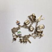 Silver charm bracelet with 15 charms, approx 35g
