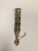 Silver large gate bracelet with heart padlock