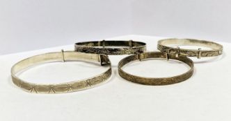 Collection of four silver christening bracelets