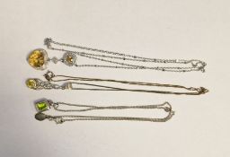 Collection of three silver necklaces with gemstone pendants