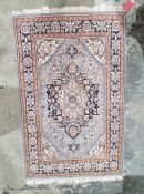 Blue ground rug with central floral medallion and herati design with floral border 155cm x 98cm