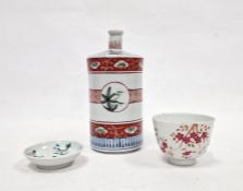 20th century Chinese bottle vase with banded and panelled decoration, a teacup with floral