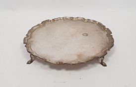 1920's silver salver, circular shaped with scalloped edge on spade feet, London 1920, maker Pearce &
