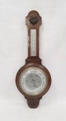 Early 20th century banjo barometer in oak case with floral cartouches