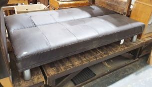 Modern faux-leather sofa bed with reclining back, on chrome-style feet