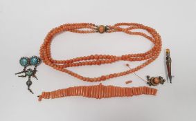 Silver dagger brooch set with agate, a silver-coloured and turquoise, white enamel brooch, a coral