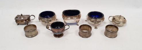Pair of George II silver salts, circular on spade feet, engraved decoration with blue glass