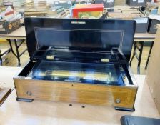 A late 19th century Harpe-Piccolo cylindrical music box, circa. 1885, inlaid lid, with receipt dated