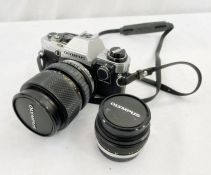 Olympus OM10 camera with an Olympus OM system S lens 35-70mm in fitted case, an another Olympus OM