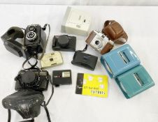 Rolleiflex SL35M case with instruction manuals and a Lubitel 2 camera case, a Prontor-SVS sillette