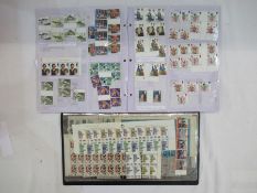 GB: Five folders of mostly Queen Elizabeth II definitive and commemorative, decimal FV £180, plus