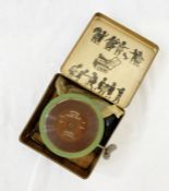 A child's Saphon tinplate clockwork gramophone, with horn, and records 'For The Young Folks' Part I,