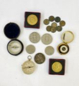 Metal pocket compass in velvet and leather case, another brass, another small black compass, a