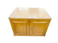 An oak collector's cabinet with pair of panel doors and enclosing eight drawers, 61cm wide