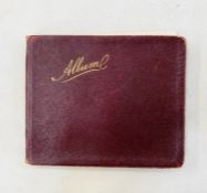 c1910s album containing artwork and drawings, a sketch of cartoonist Bruce Bairnsfather, and
