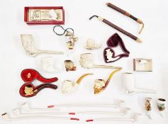 Clay pipes including pipes with bowls in the form of heads, long stamped clay pipes, books and