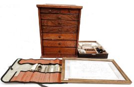 Miniature microscope in box, rolled case of possibly bookbinder's tools, collector's cabinet