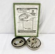 A Mikiphone pocket phonograph in 11.5cm diameter tin with The Play Pictorial advertising 'At last